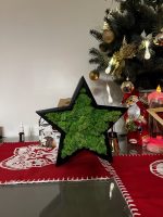Vánoční hvězda vyrobená ze dřeva a lišejníku
